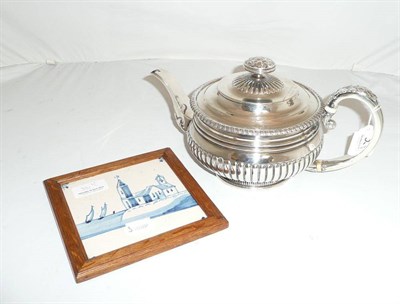 Lot 381 - A George III silver teapot dated 1819 and a Delft tile