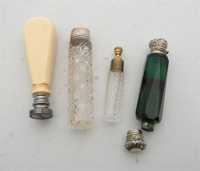 Lot 425 - An ivory-handled hand seal and three scent bottles