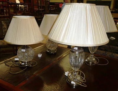 Lot 454 - Two pairs of cut glass table lamps with modern shades