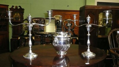 Lot 457 - A pair of silver plated two branch candlesticks and a wine cooler