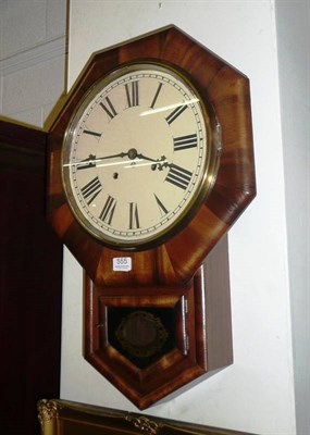 Lot 555 - A walnut cased wall clock with painted dial by the Ansonia watch company