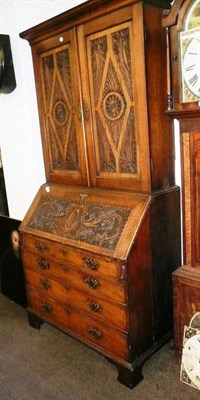 Lot 560 - 19th century carved oak bureau bookcase