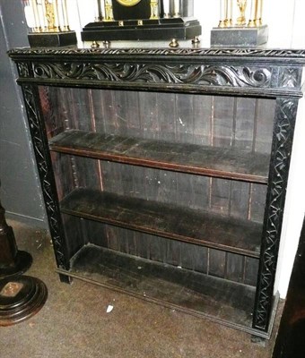 Lot 563 - Pair of carved oak bookcases