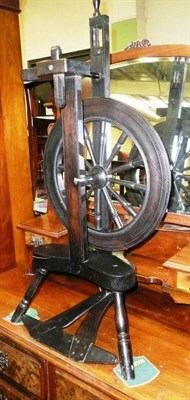 Lot 600 - Ebonised spinning wheel