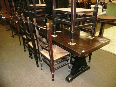 Lot 601 - A refectory dining table and eight rush seated chairs including two carvers