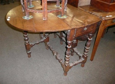 Lot 608 - Oak gateleg dining table