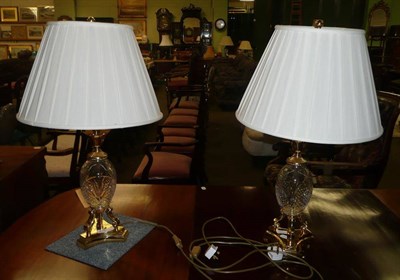 Lot 626 - A pair of cut glass table lamps with cream gathered shades