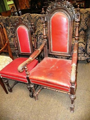 Lot 653 - Carved oak open armchair and another