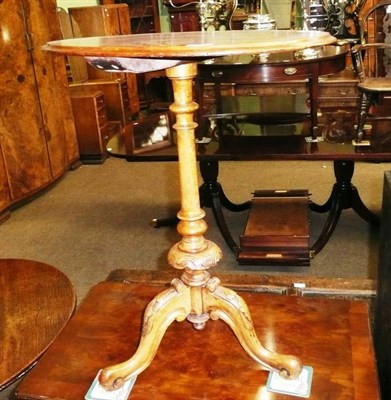 Lot 663 - An oval Victorian walnut tripod table