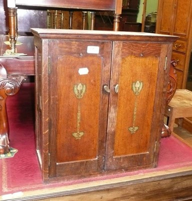 Lot 687 - Art Nouveau small oak hanging wall cabinet