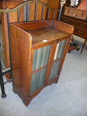 Lot 787 - An oak bookcase containing a set of Encyclopedia Britannica