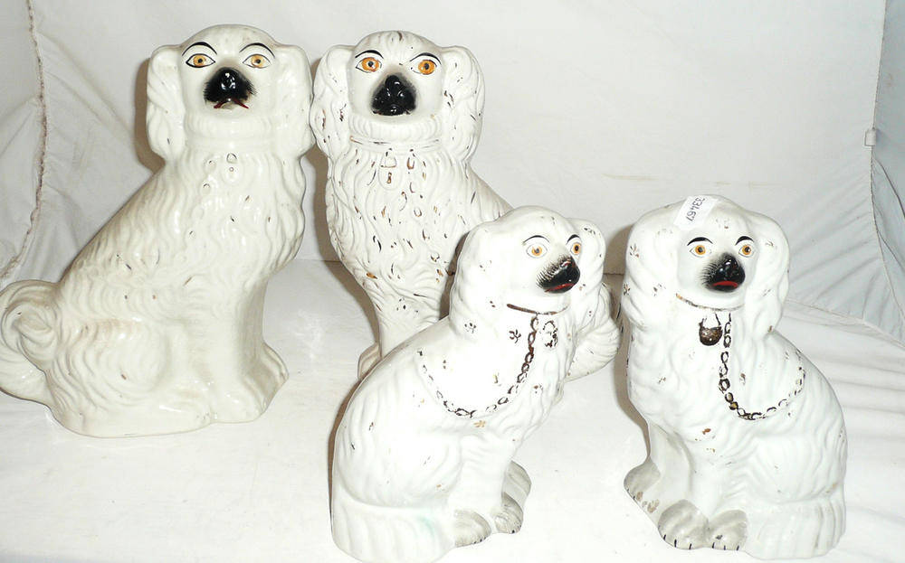 Lot 13 - Four Victorian Staffordshire spaniel dogs