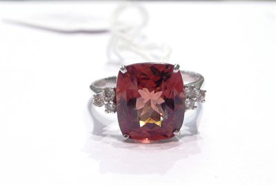Lot 54 - An 18ct white gold garnet and diamond ring
