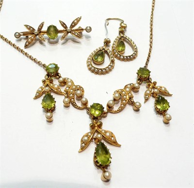 Lot 66 - A perdiot and seed pearl necklace, a peridot and seed pearl brooch and a pair of drop earrings...