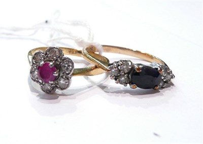 Lot 68 - A ruby and diamond cluster ring and a sapphire ring