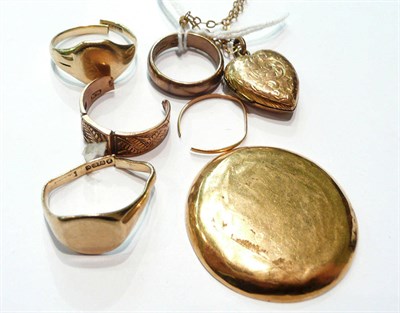 Lot 81 - Five 9ct gold rings (one gypsy set), a 9ct gold locket on chain and an 18ct gold watch back