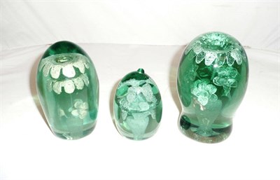 Lot 104 - Three Victorian glass dumps with flower head designs