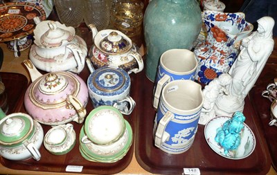 Lot 147 - Two trays including Chinese tea pot, Mason's ironstone jug, Parian figures, tea pots,...