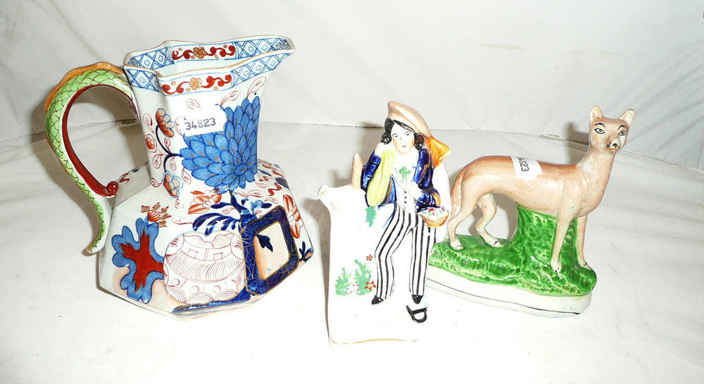 Lot 150 - Davenport pottery jug with snake handle and two Staffordshire figures