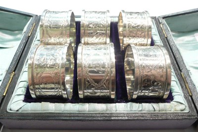 Lot 164 - Cased set of six silver napkin rings