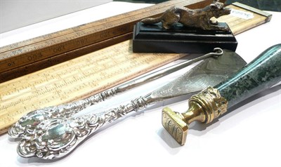 Lot 181 - Brass seal, small model of a fox, silver-handled button hook and shoe horn, E J Venner London slide