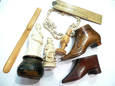 Lot 182 - Two boot-shaped snuff boxes and small ivory figures, an ivory folding rule, etc