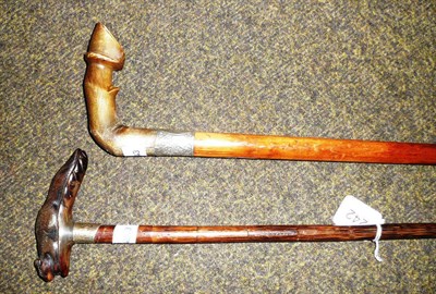 Lot 242 - Two carved horn-handled walking sticks with a hoof and a squirrel
