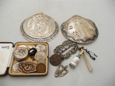 Lot 260 - Two carved mother of pearl shells, religious medallions, silver buckle, mother of pearl handled...