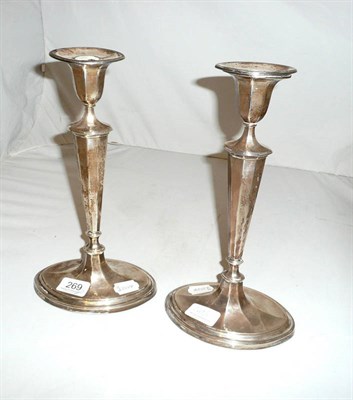 Lot 269 - A pair of silver candlesticks