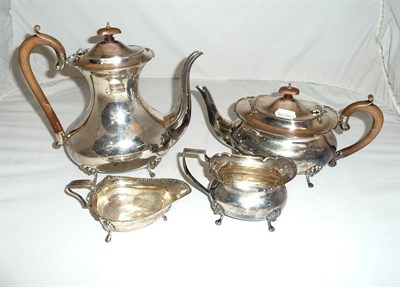 Lot 285 - Three piece silver tea set and an associated silver cream jug