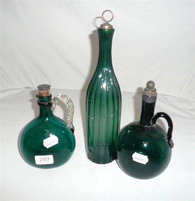 Lot 289 - Two emerald green glass ewers and a decanter and cork stopper