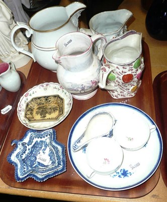 Lot 298 - A tray of 18th century porcelain including a faience jug, two Bacchus jugs, two blue and white...