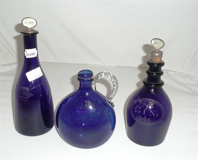 Lot 300 - Two Bristol blue glass decanters with cork stoppers and a ewer