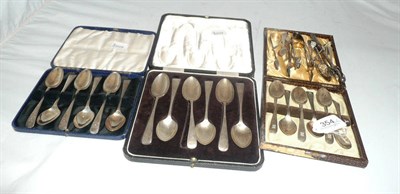 Lot 354 - Three sets of cased silver tea spoons, silver tongs etc