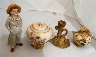 Lot 357 - Four pieces of Royal Worcester - candle stick, vase and cover, twin handled vase and a hat pin...