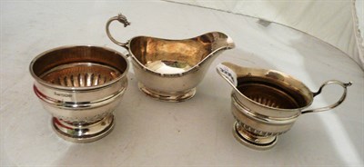 Lot 360 - Silver sugar and cream and a silver sauce boat