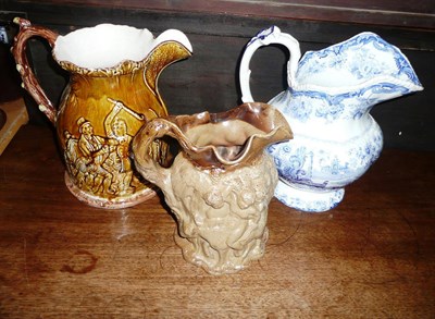 Lot 378 - Large majolica jug, salt glaze jug and a blue and white jug