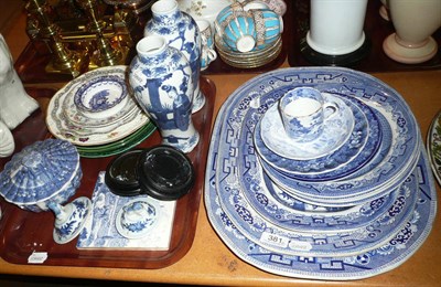 Lot 381 - Three Willow pattern meat dishes, four meat plates, a small quantity of blue and white pottery,...