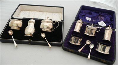 Lot 411 - Two cased silver condiment sets