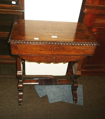 Lot 483 - A French rosewood work table raised on shaped splayed legs