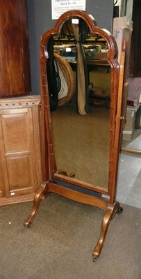 Lot 501 - A large walnut cheval mirror on a plain stand with cabriole legs