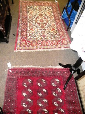 Lot 516 - Two red ground rugs