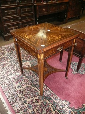 Lot 550 - An inlaid rosewood envelope card table