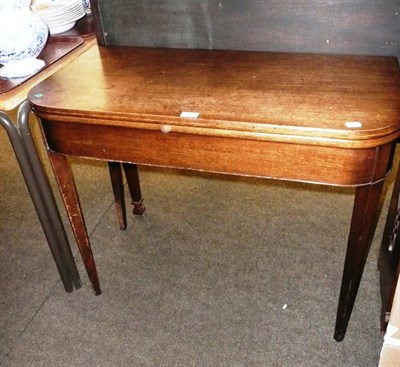 Lot 562 - 19th century mahogany fold-over tea table