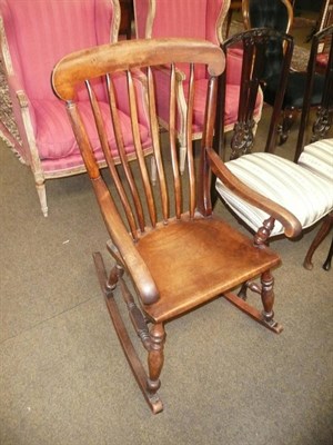 Lot 571 - A mahogany slat back rocking chair