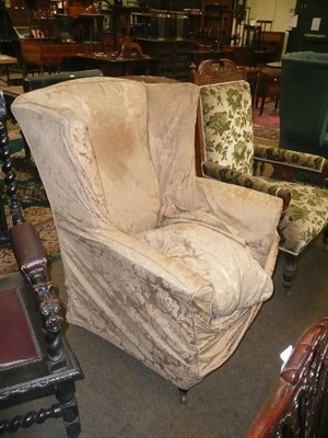 Lot 585 - Late 19th/early 20th century upholstered wing armchair