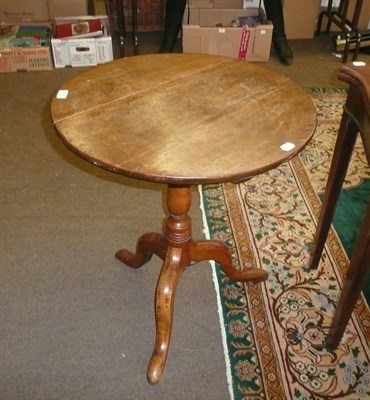 Lot 589 - A 19th century oak tripod table