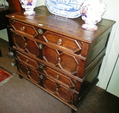 Lot 614 - Continental oak four height chest of drawers