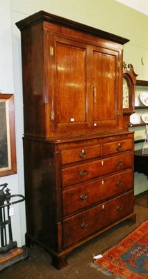 Lot 618 - Oak cupboard on chest/press with key