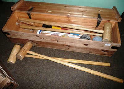 Lot 1010 - A Garden Croquet Set, containing mallets, balls and hoops, in a pine box, retailed by C.Hamley